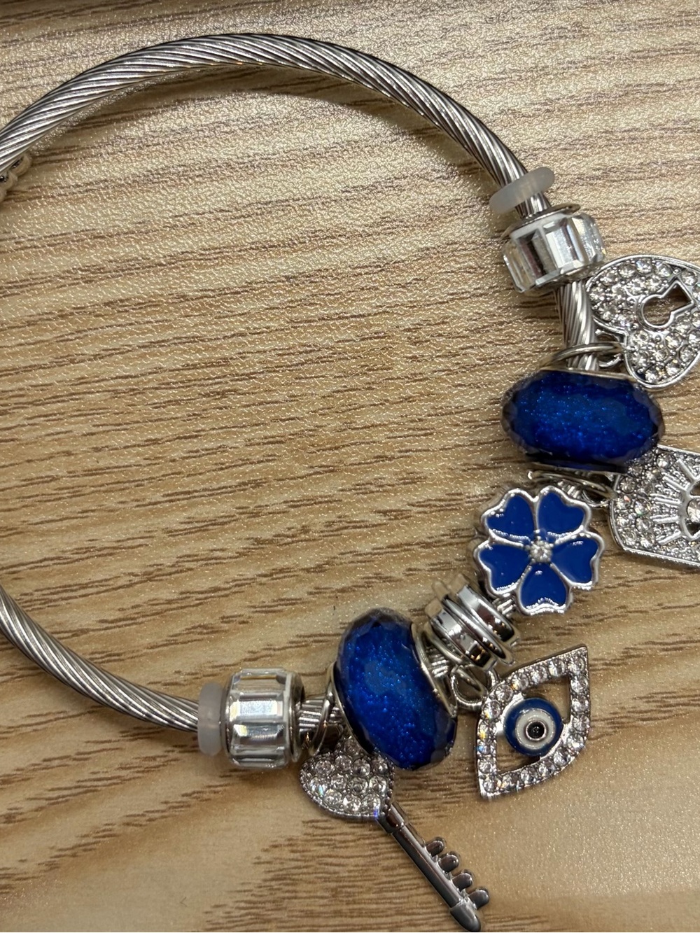 Silver Bracelet with Blue Glass Beads and Charms